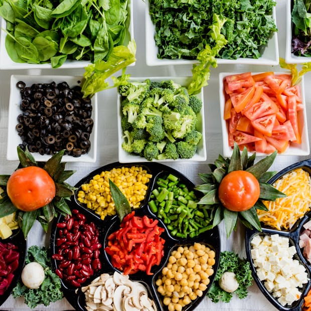 Colorful close-up bowl of fruits and vegetables arranged for a healthy meal