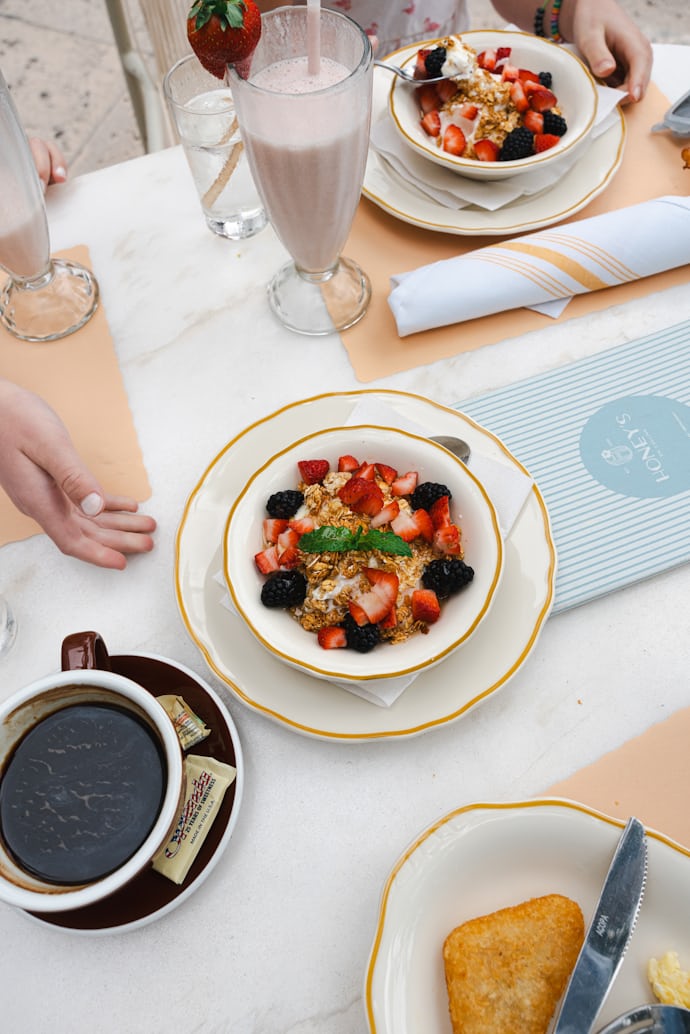 Breakfast table with berry smoothie and nutrient-rich toppings