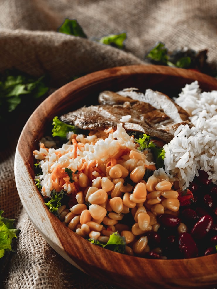 Balanced chicken rice bowl with beans and vegetables as healthy comfort food