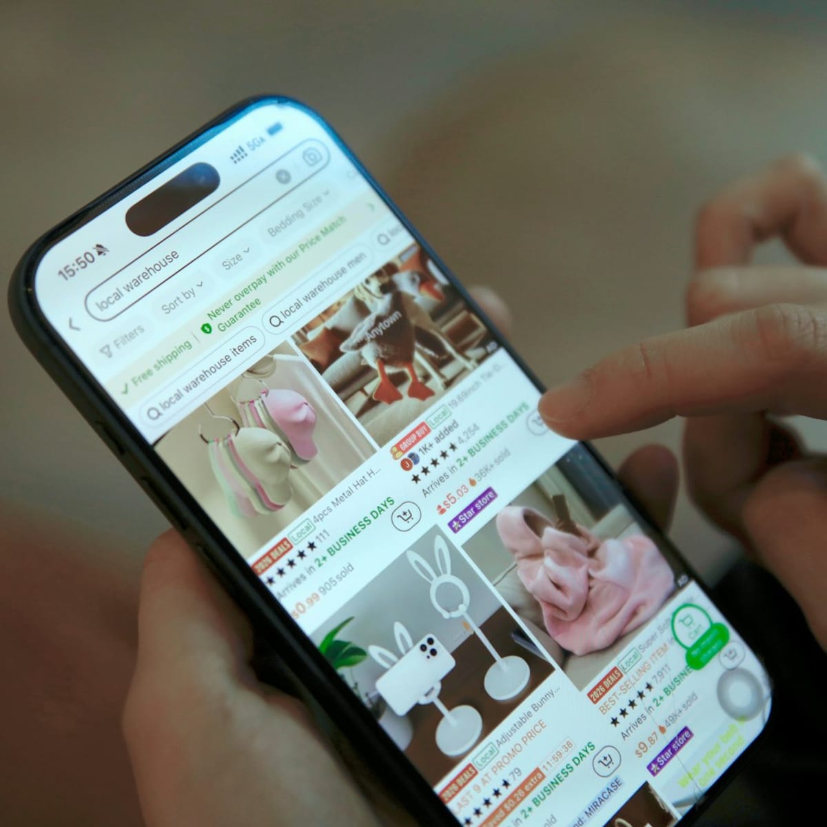 Person browsing fashion shopping app on phone to represent AI-driven retail experience