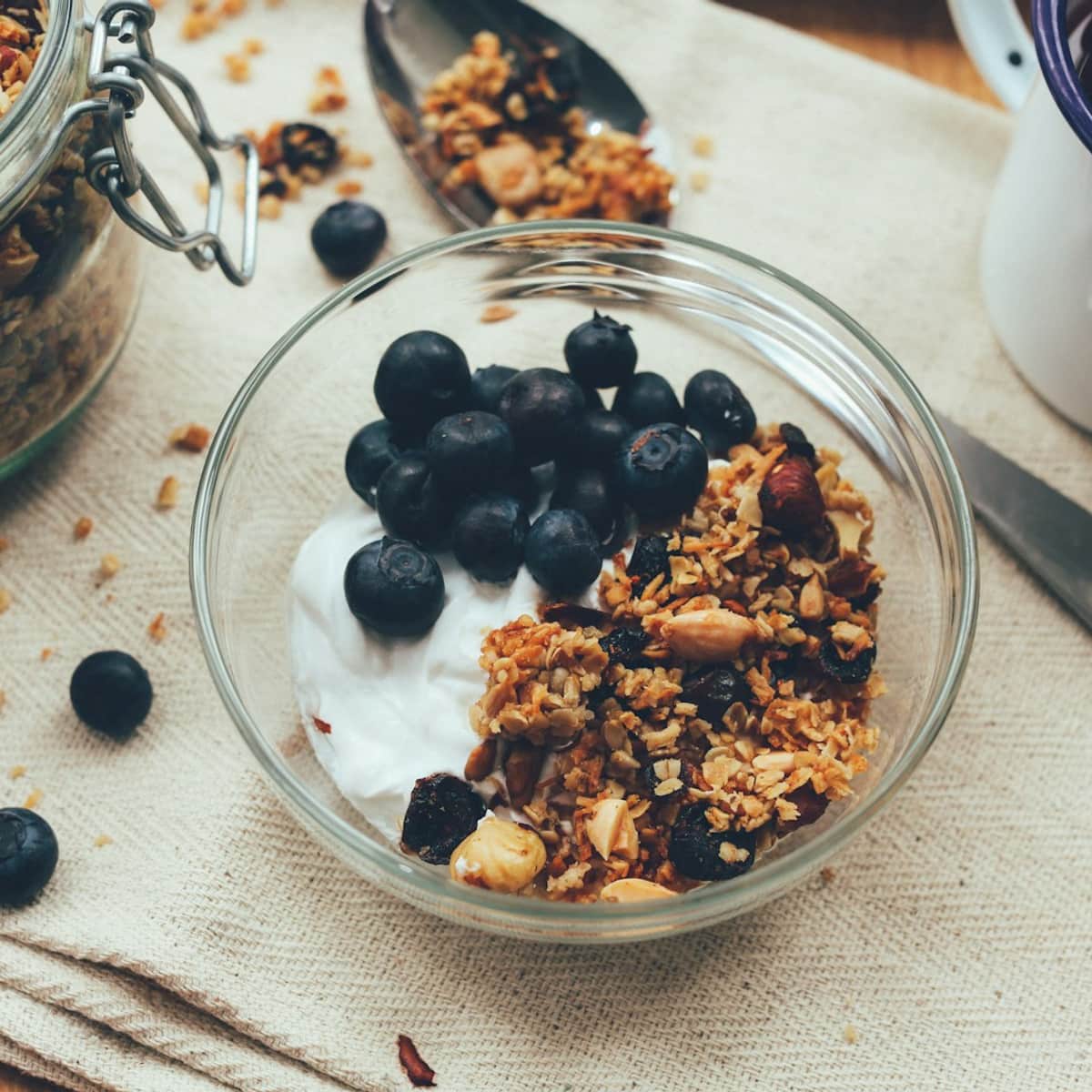 Granola and berry bowl representing nourishing habits that support a calmer mind