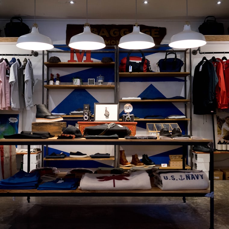 Modern boutique clothing rack featuring eco-conscious fashion pieces and natural textures