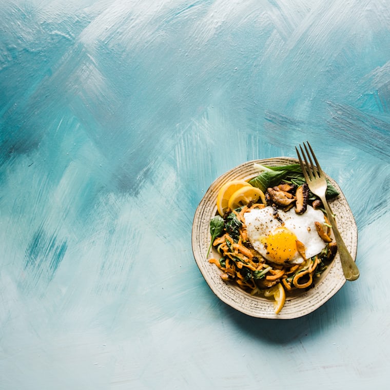 Close-up of a vibrant healthy food plate with grains and fresh vegetables