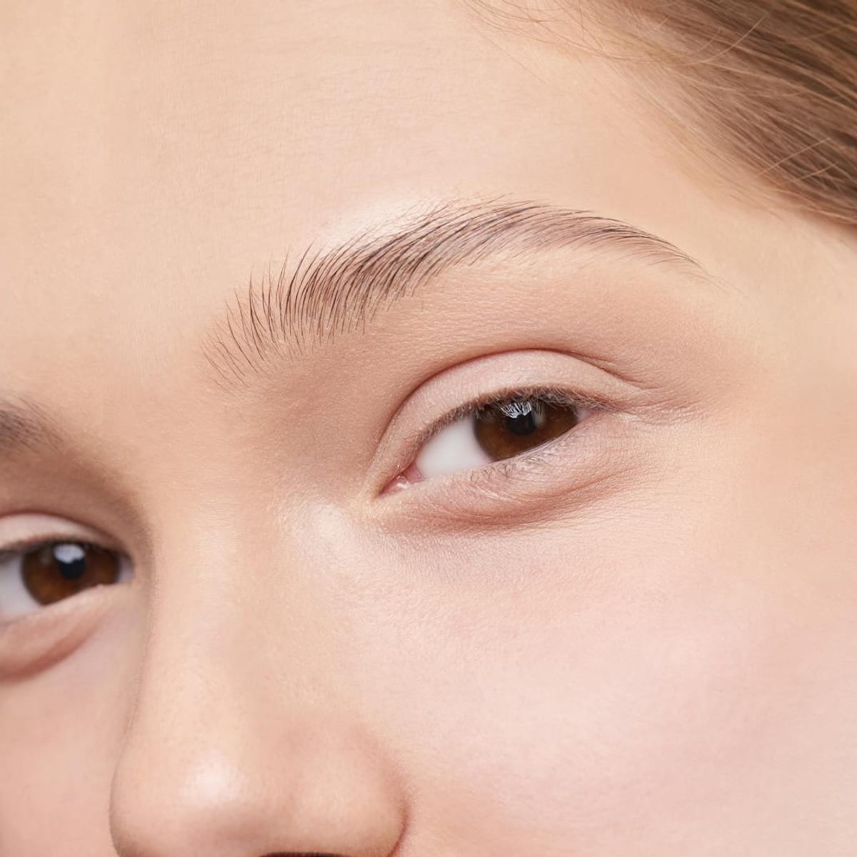 Close-up portrait of woman with healthy skin discussing anti-aging care