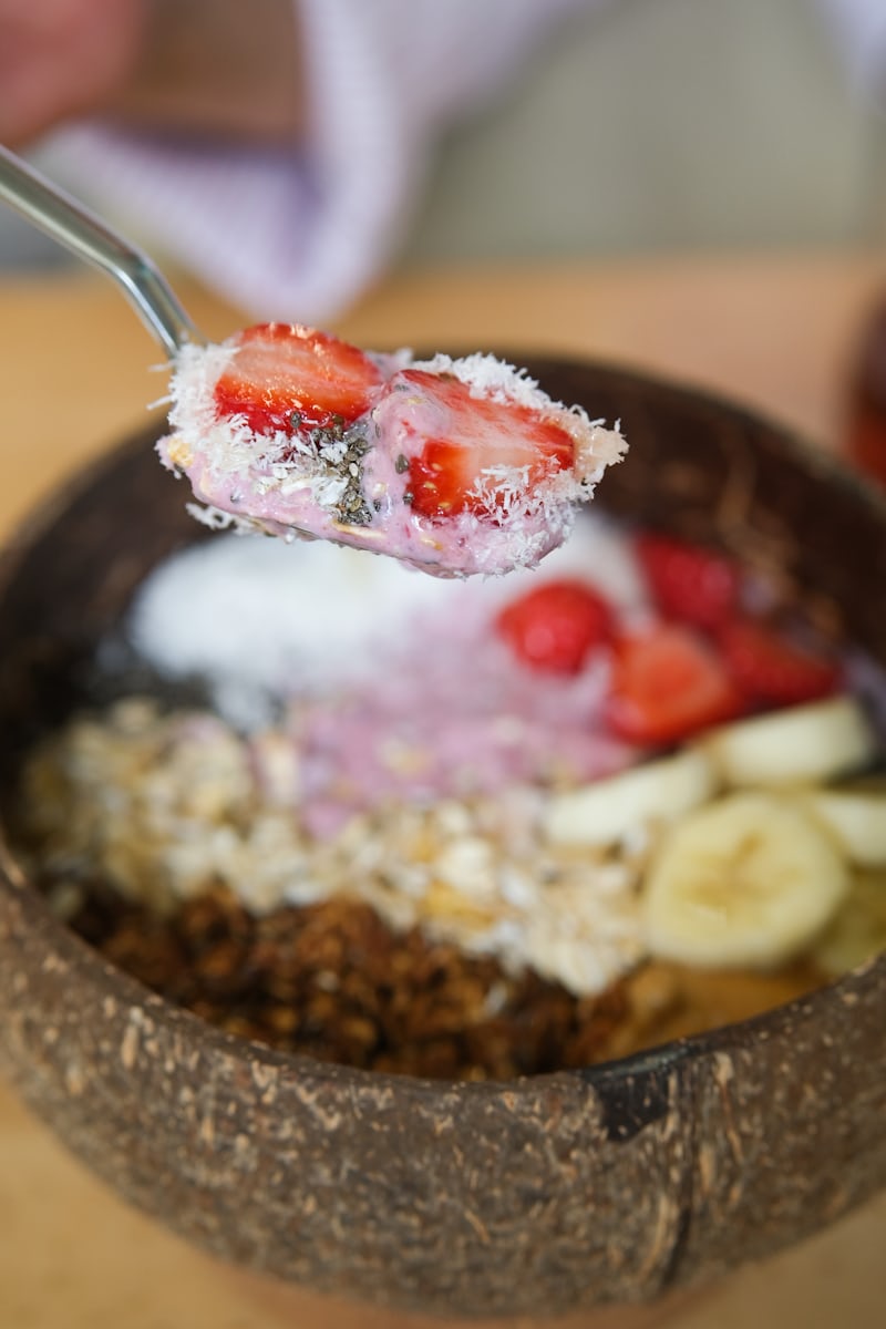 Colorful smoothie bowl with strawberries and granola representing healthy food trend