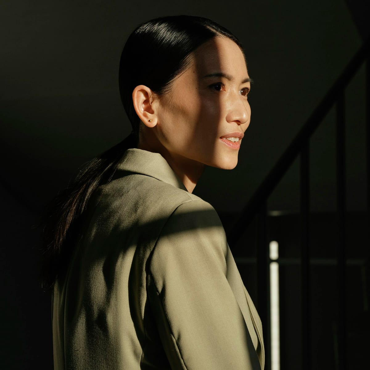 Elegant woman in tailored blazer with refined quiet luxury styling