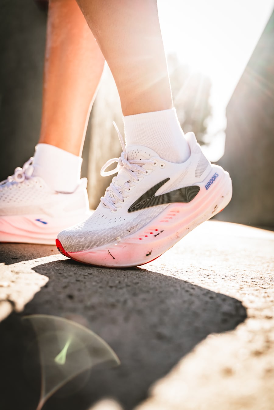 Close-up of white running shoes during a brisk outdoor walk